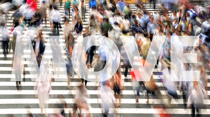 blur of people in a crosswalk